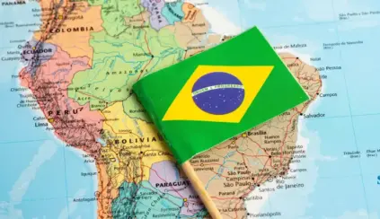 Brazilian flag over a map of South America, showing states and countries in the background; reference for the CBAM and Brazilian beef theme.